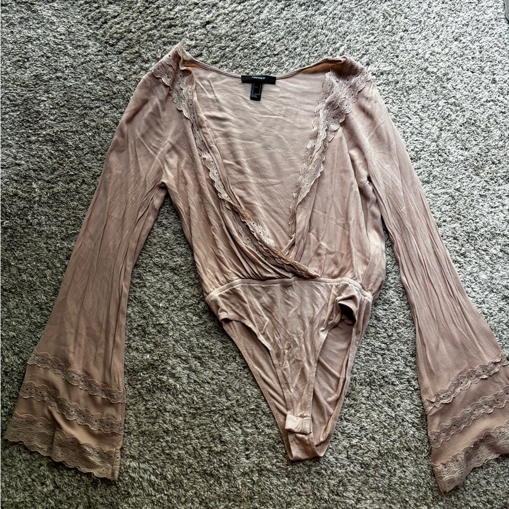 Tan body suit with wide sleeves
